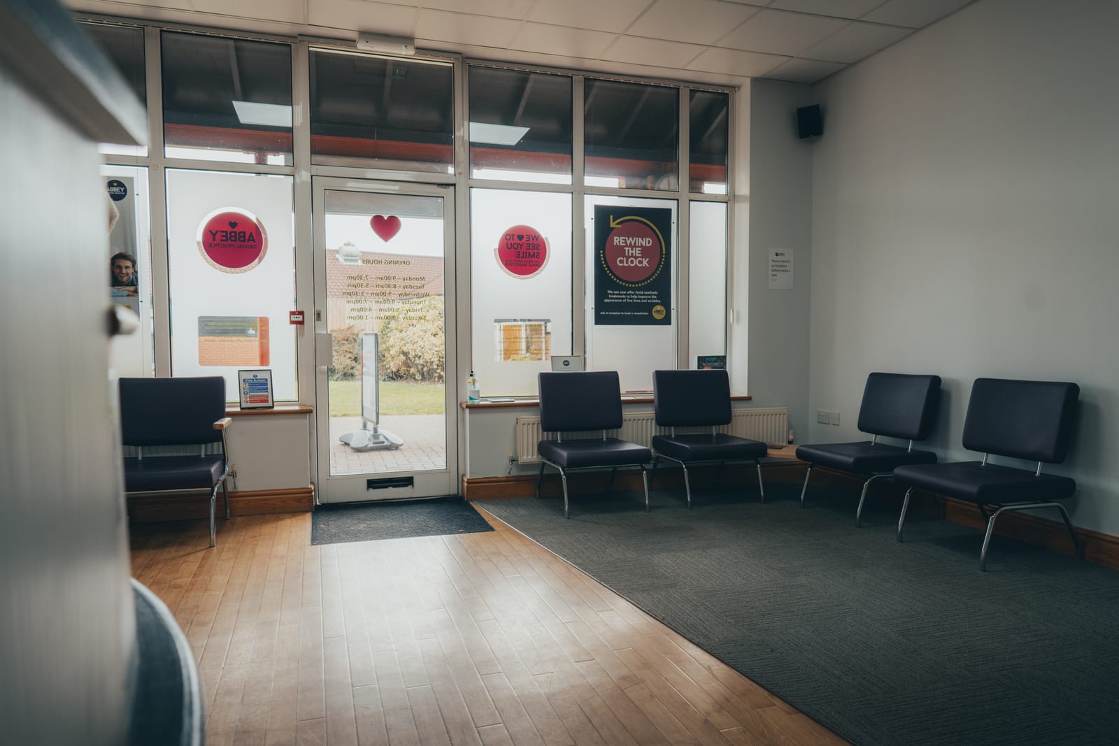 Bright waiting room at Abbey Dental Practice, looking out to the entrance